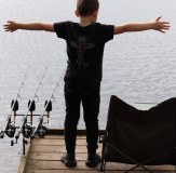 Vass Carp Rising Kids Tee Shirt Fishing Boy stood by the water