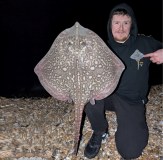 Vass Ray Rising Hoodie Sea Angler holding Ray Fish
